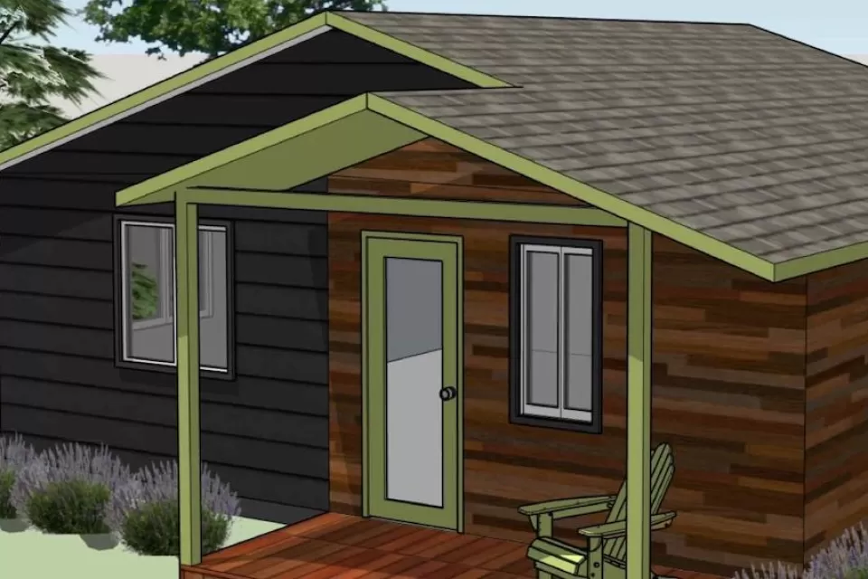 Rendering of cabin-style accessory dwelling unit with green trees in background.